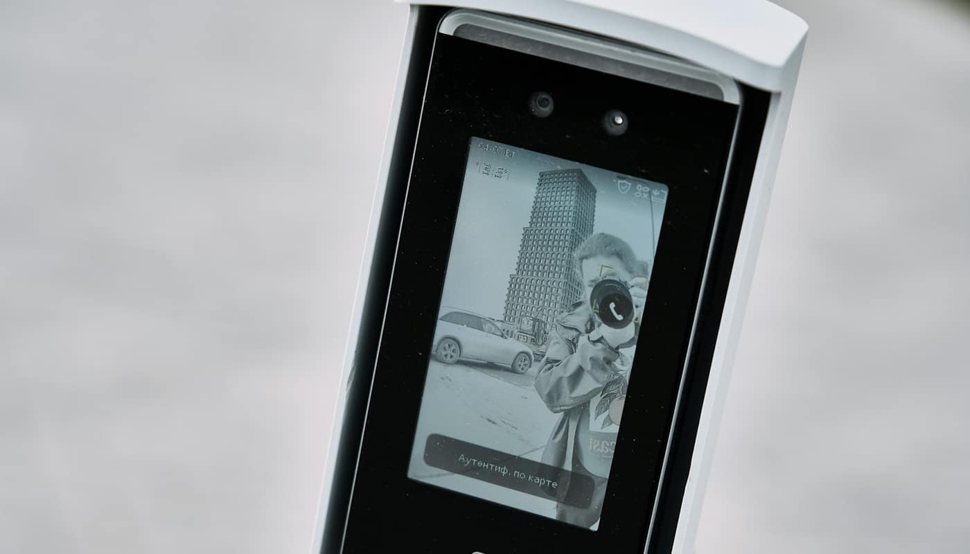 A wall-mounted face recognition terminal with a small screen